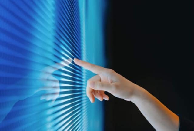 Image of hand using a digital screen