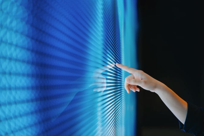 Image of hand using a digital screen