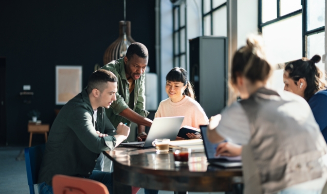 Diverse Team Working Together In Modern Co Working Space